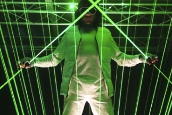 Extreme Beam Laser Light performer creating a mesmerizing visual spectacle with vibrant, high-intensity laser beams.