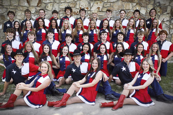 Teenage dance group, Hot Hip Country Wranglers, posing in coordinated outfits, showcasing their unique fusion of hip-hop and country dance styles.