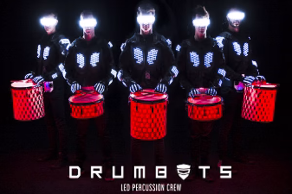 LED Drumbots performing a high-energy show, combining futuristic LED-lit drumming with synchronized beats and striking visual effects.