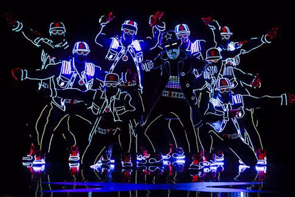 Light Balance performers dazzling in an electrifying LED dance show, blending choreography with vibrant, high-tech lighting effects.